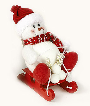 Bonhomme de neige sur sa luge rouge à poser ou suspendre